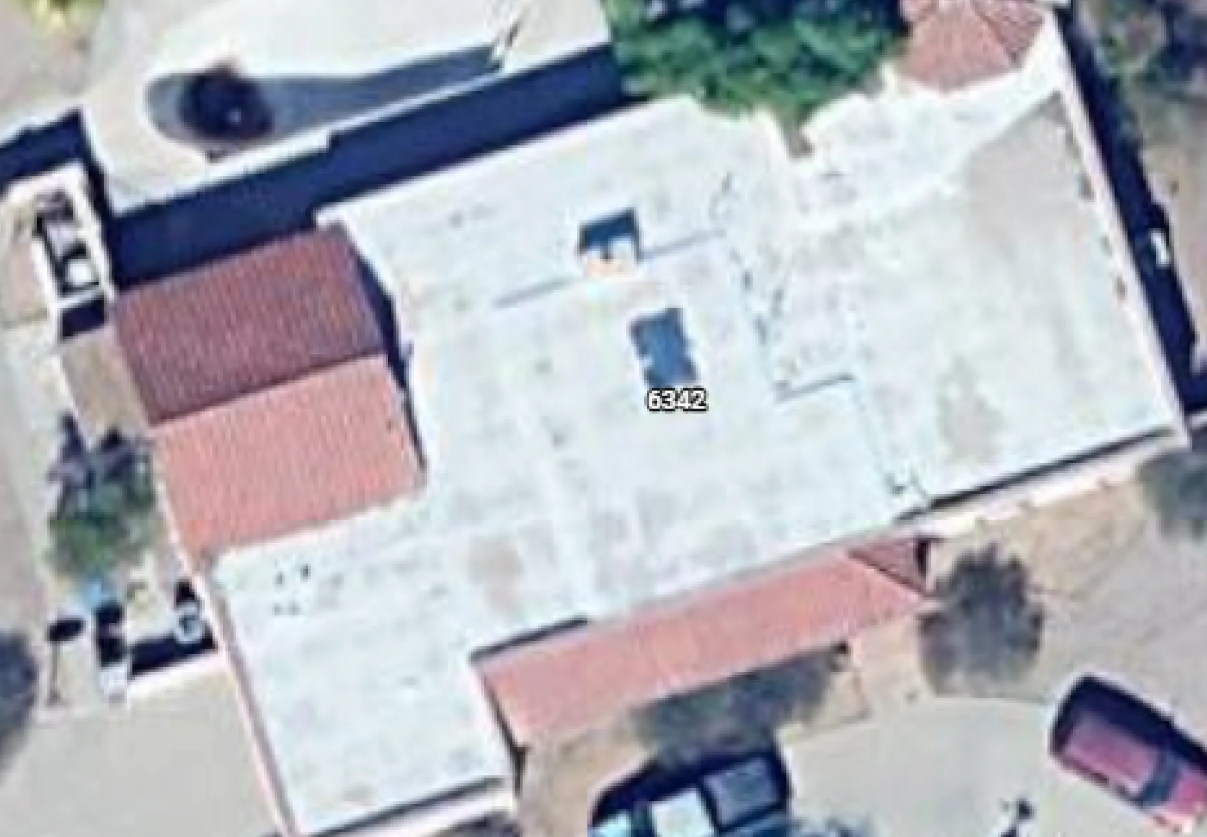 Standard satellite imagery of a residential neighborhood